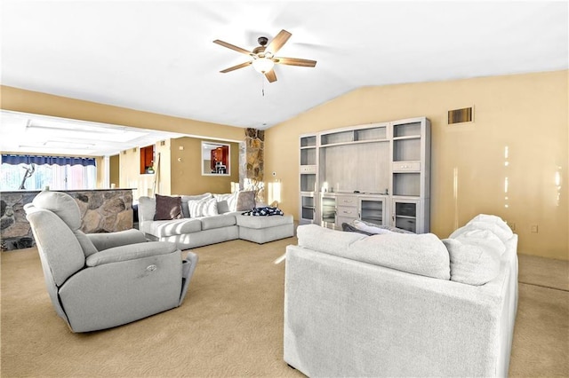 carpeted living room with lofted ceiling and ceiling fan