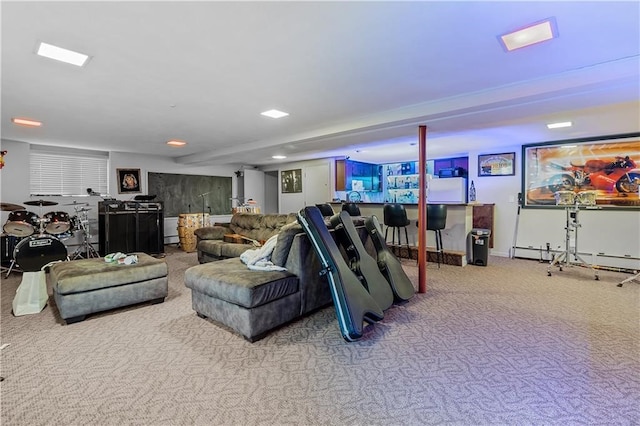 recreation room with a baseboard radiator, bar, and carpet floors