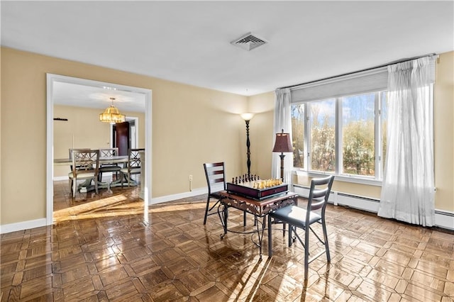 dining area featuring a chandelier