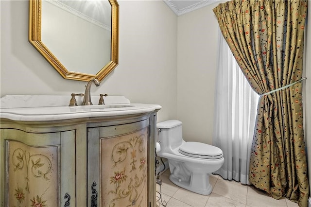 bathroom featuring vanity, tile patterned floors, and toilet