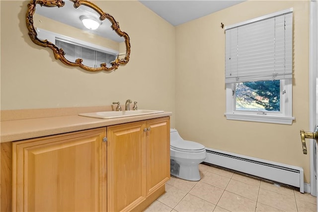 bathroom featuring a baseboard radiator, vanity, toilet, and tile patterned flooring