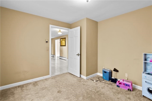 interior space with washer / clothes dryer and baseboard heating