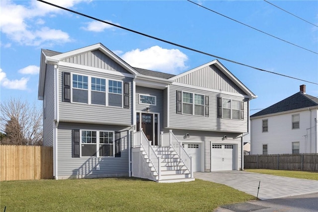 view of front facade with a garage and a front lawn