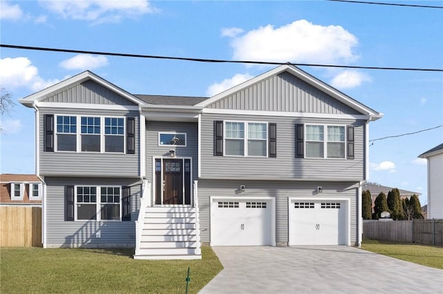 view of front of home featuring a garage and a front lawn