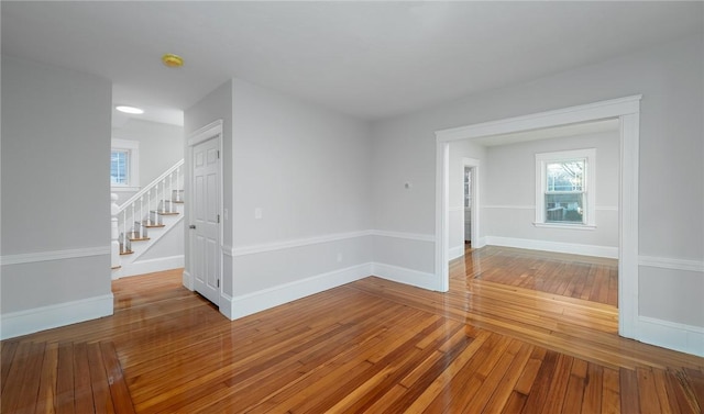 spare room with hardwood / wood-style floors