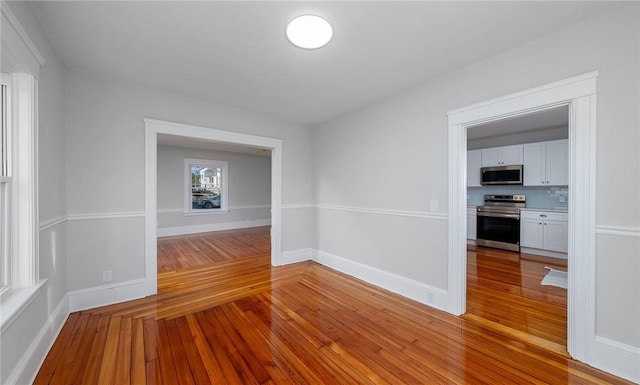 spare room with light hardwood / wood-style flooring