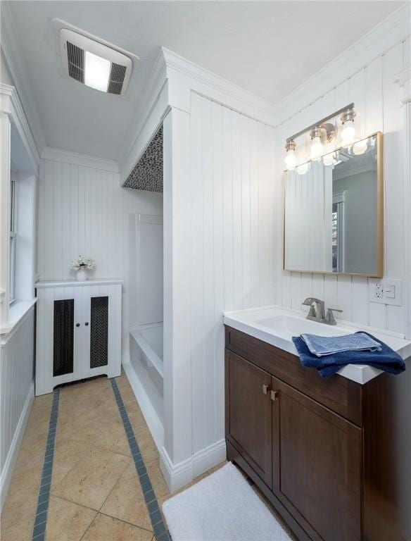 bathroom featuring french doors, crown molding, vanity, tile patterned flooring, and a washtub