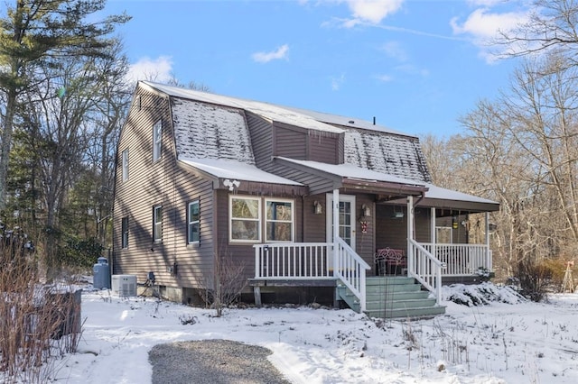 view of front of house with central AC and a porch