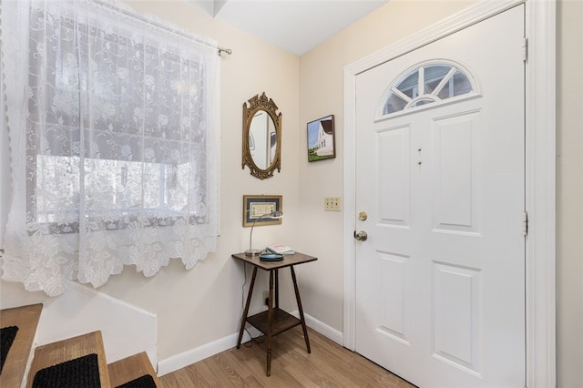 foyer with light hardwood / wood-style floors