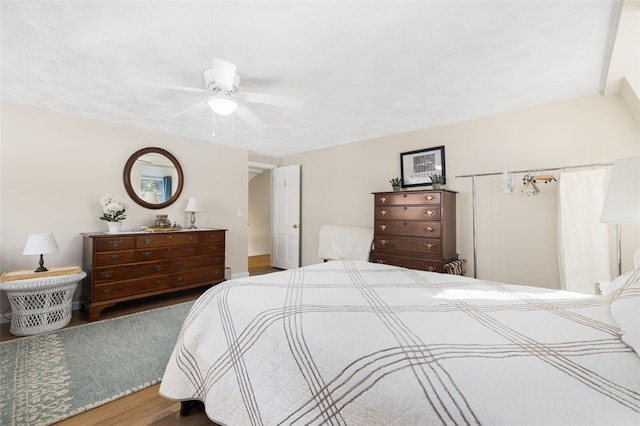 bedroom with hardwood / wood-style floors and ceiling fan