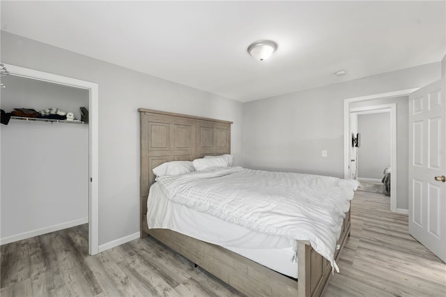 bedroom featuring light wood-type flooring