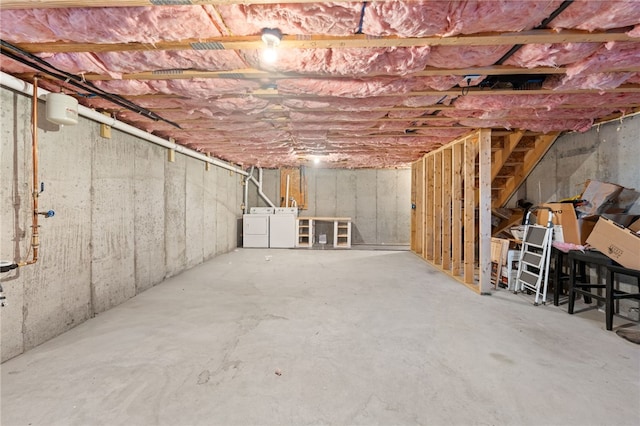 basement with washing machine and clothes dryer