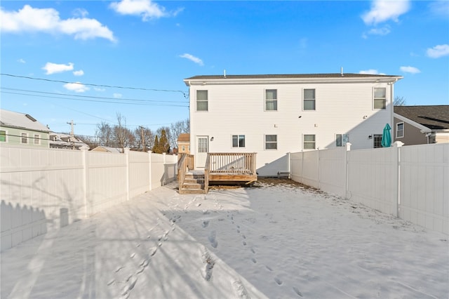 rear view of property with a wooden deck