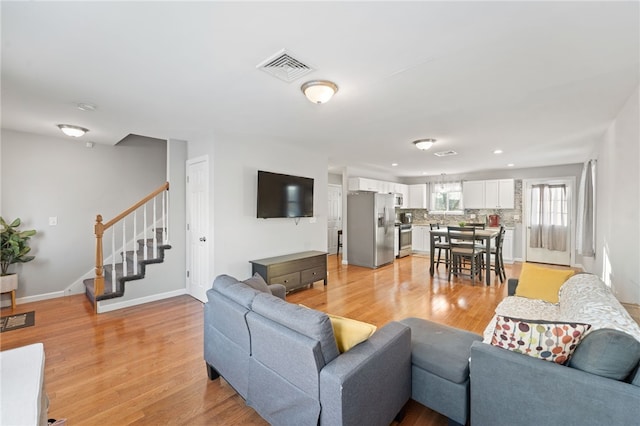 living room featuring light wood-type flooring