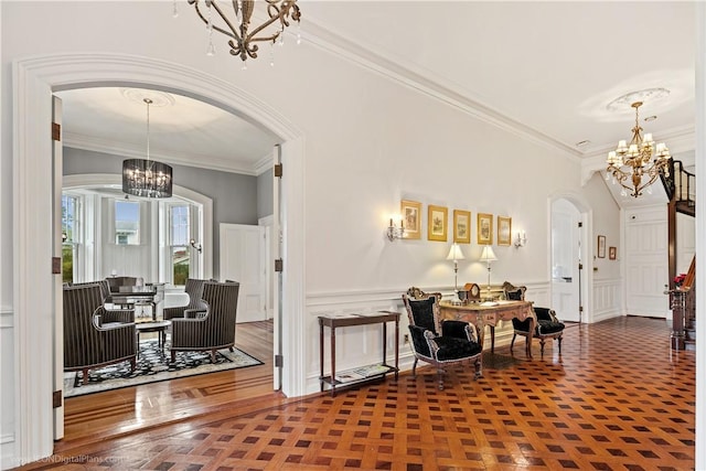 dining room with crown molding and a chandelier