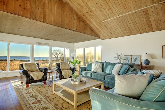 sunroom / solarium with wood ceiling and lofted ceiling