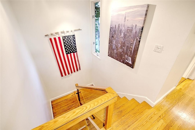 stairway featuring hardwood / wood-style flooring