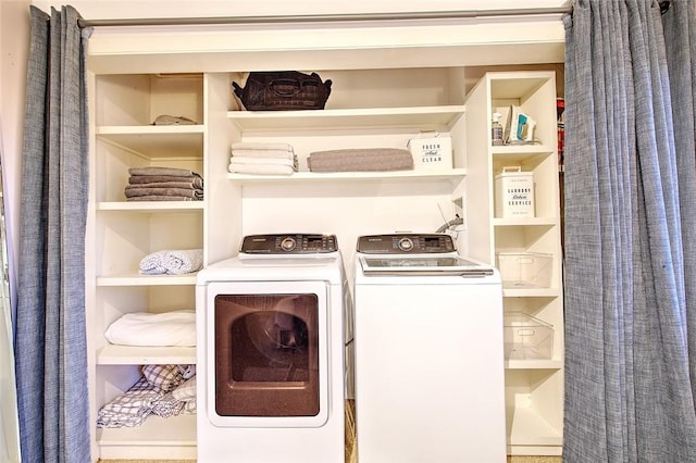 laundry area with washer and clothes dryer