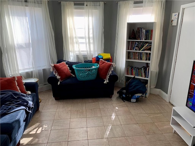 living area with light tile patterned floors