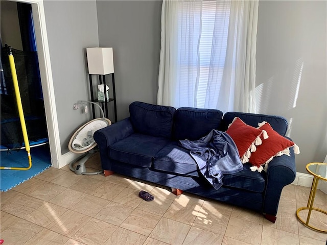 living room with light tile patterned flooring