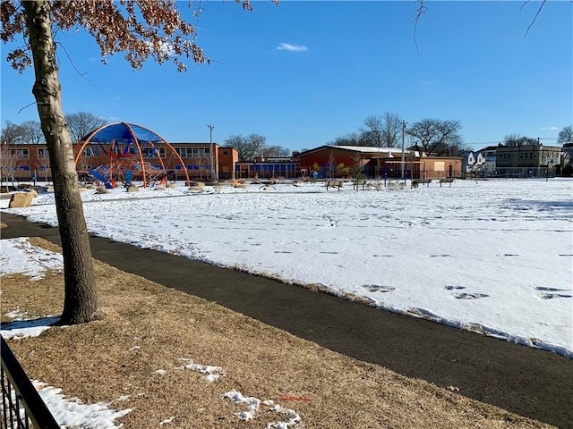 snowy yard with a playground