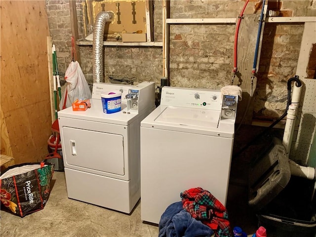 laundry area with independent washer and dryer