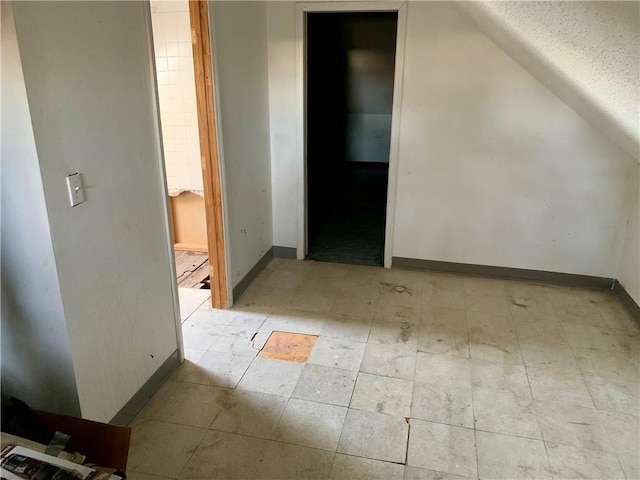 bonus room featuring lofted ceiling