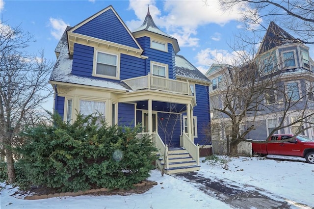 victorian-style house with a balcony