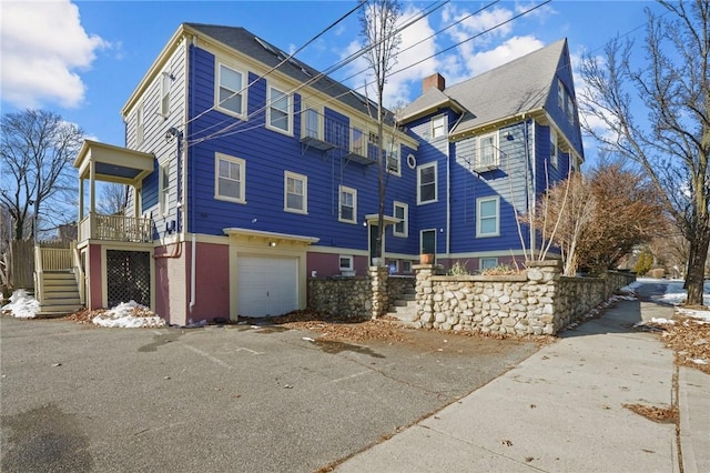 view of side of home featuring a garage