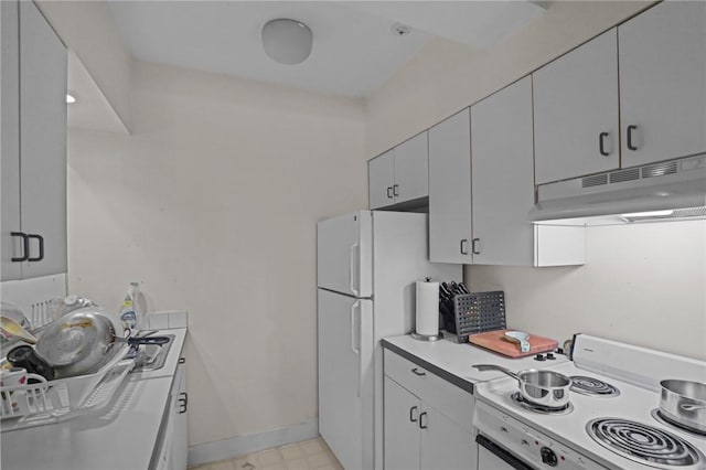 kitchen featuring white cabinetry and white appliances