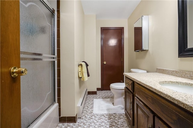 full bathroom with a baseboard radiator, vanity, toilet, and combined bath / shower with glass door