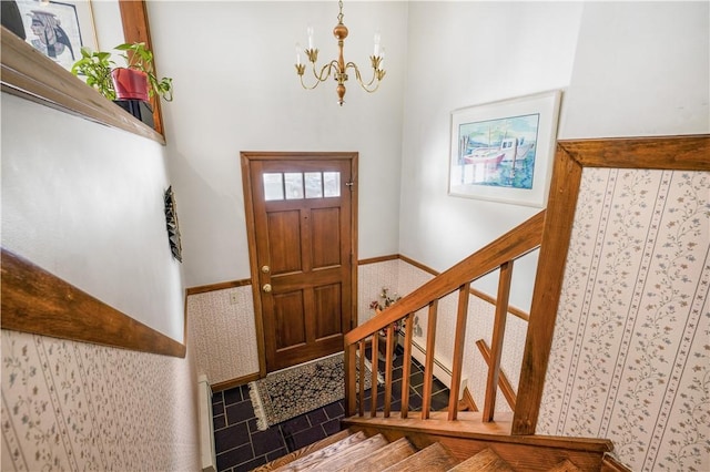 entryway with a notable chandelier