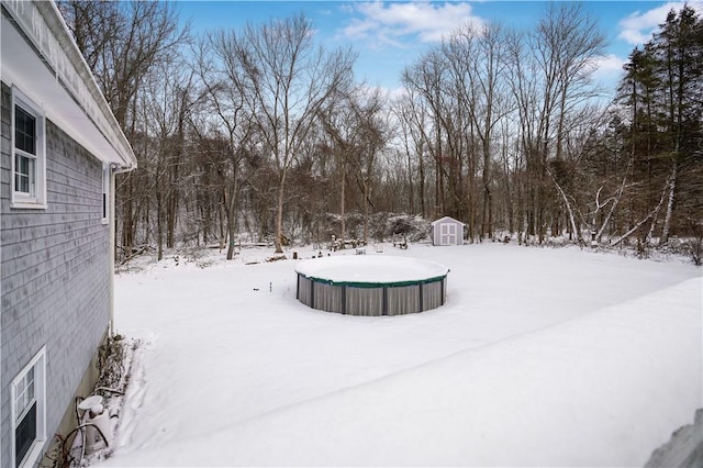 snowy yard with a storage unit