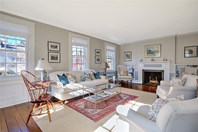 living room featuring hardwood / wood-style floors and crown molding