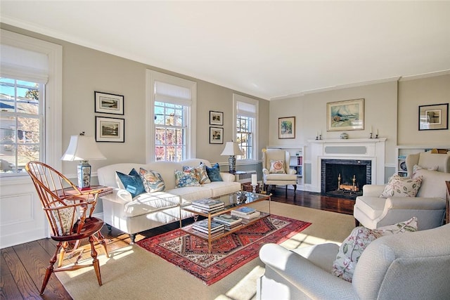 living room featuring hardwood / wood-style flooring and ornamental molding