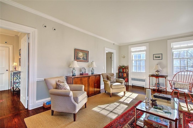 living room with crown molding, radiator, and dark hardwood / wood-style flooring