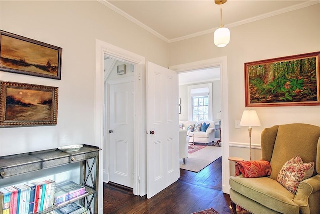 sitting room with crown molding and dark hardwood / wood-style floors