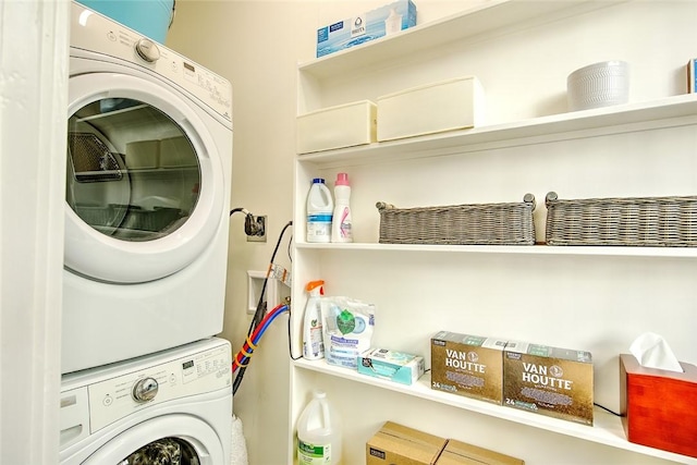 laundry room with stacked washer and clothes dryer