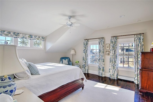 bedroom with a baseboard radiator, dark hardwood / wood-style floors, ceiling fan, and vaulted ceiling