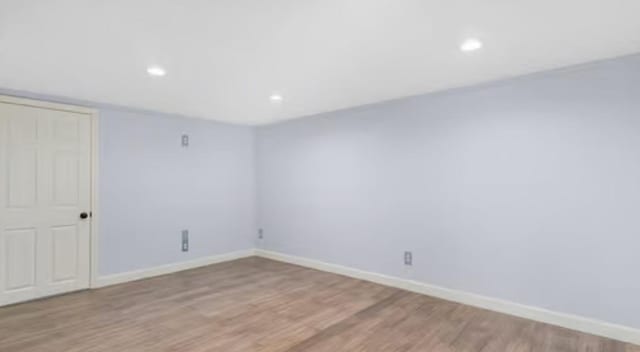 spare room featuring light wood-type flooring