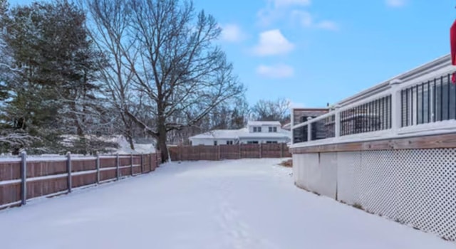 view of yard covered in snow