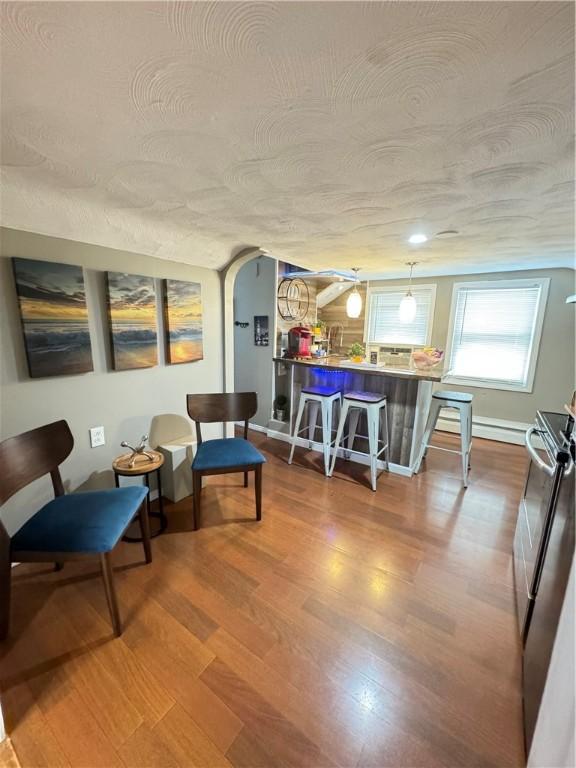 interior space with hardwood / wood-style flooring and a textured ceiling