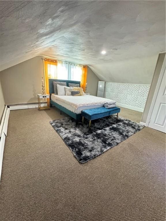 bedroom with vaulted ceiling, carpet, and a baseboard heating unit