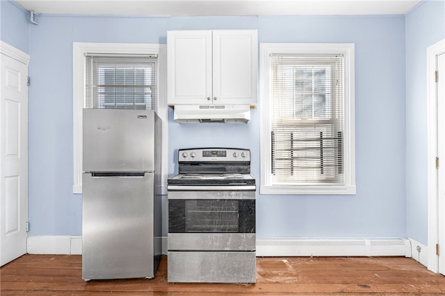 kitchen featuring stainless steel appliances, white cabinetry, wood-type flooring, and a baseboard radiator