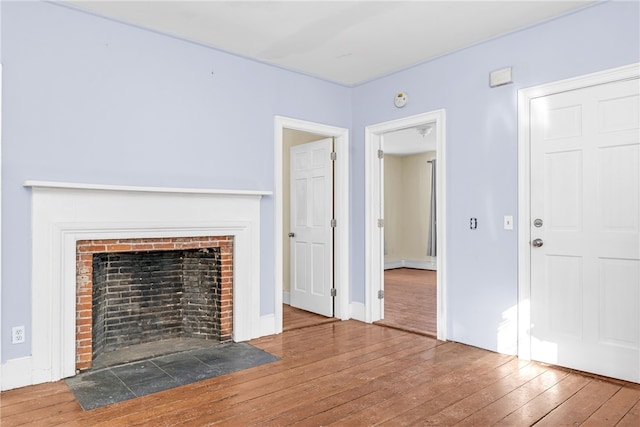 unfurnished living room featuring wood-type flooring