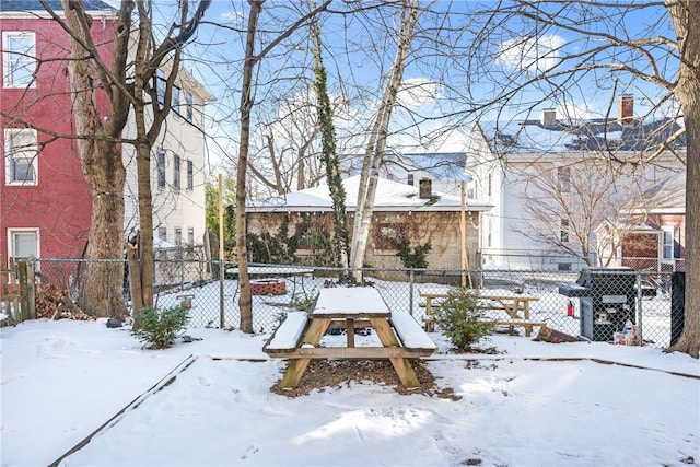 view of yard layered in snow