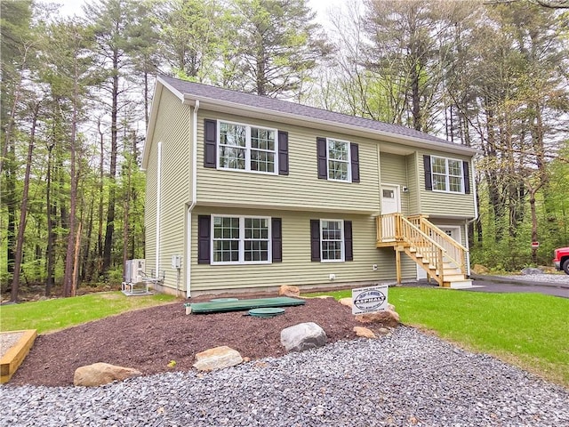 650 Reservoir Rd, Burrillville, RI 02859 - raised ranch featuring stairs, a front yard, and aphalt driveway