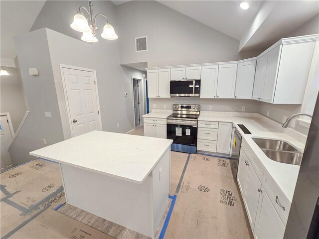 650 Reservoir Rd, Burrillville, RI 02859 - kitchen with a sink, stainless steel appliances, visible vents, a center island, and a notable chandelier