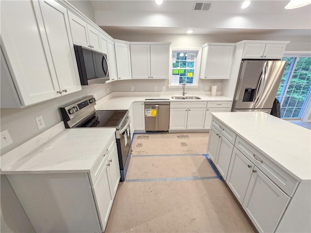 650 Reservoir Rd, Burrillville, RI 02859 - kitchen featuring a sink, stainless steel appliances, visible vents, recessed lighting, and white cabinetry