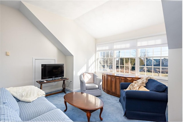 living room with light carpet and vaulted ceiling